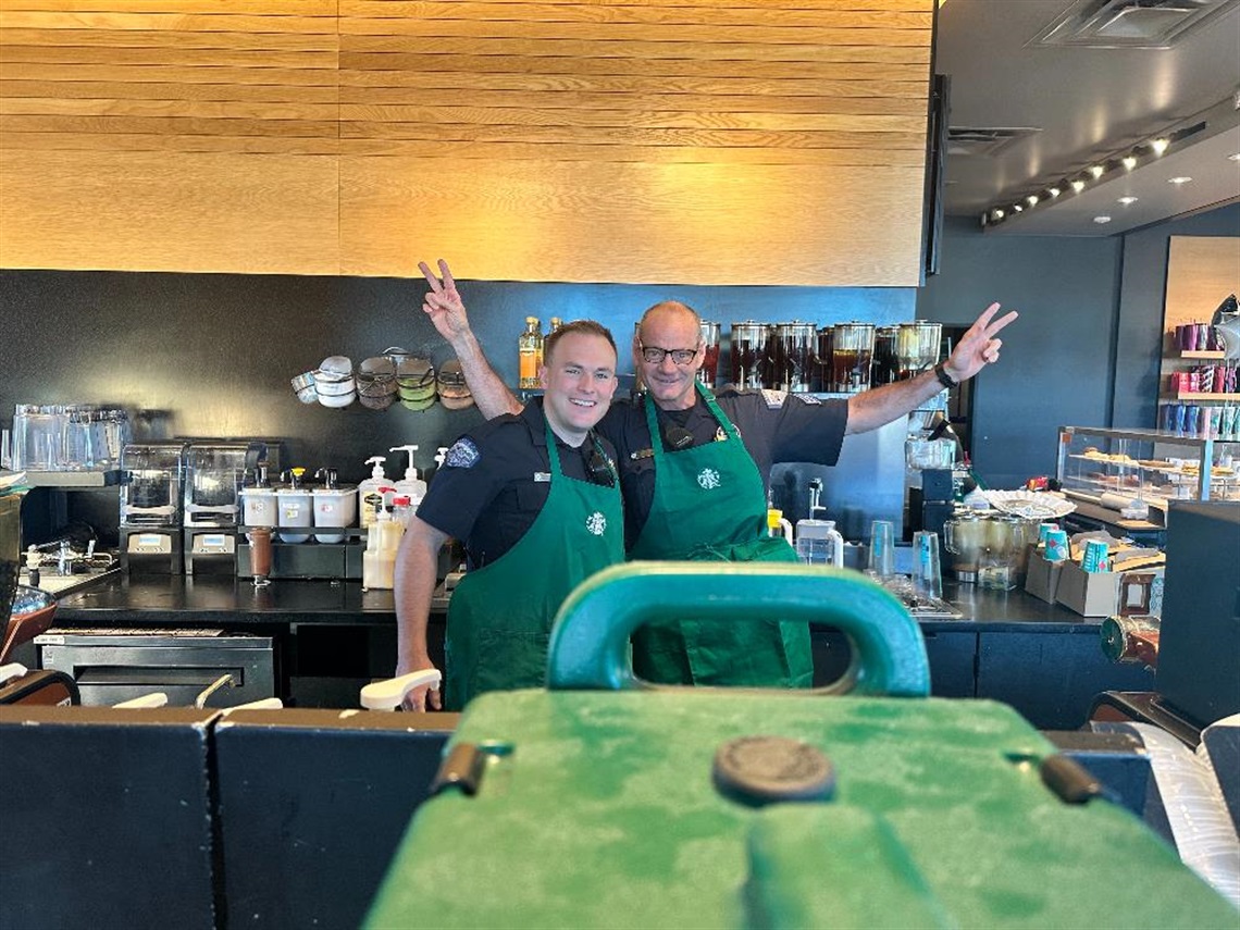 Police officers with Starbucks aprons on