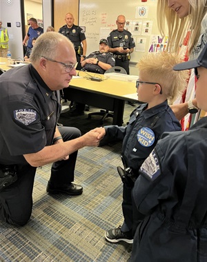 Officer Shaking hands with a kid